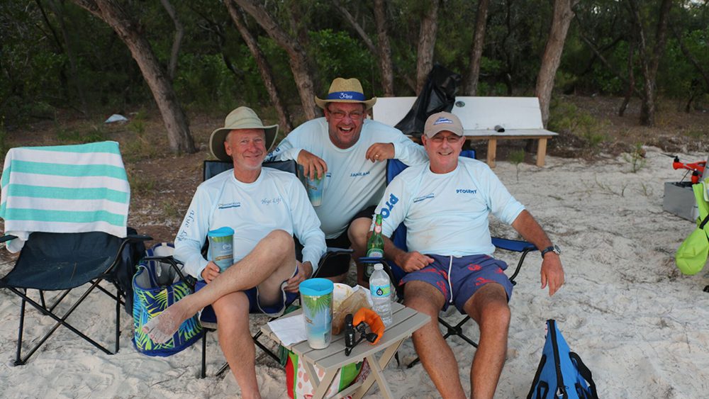 Three men enjoying a day at the beach