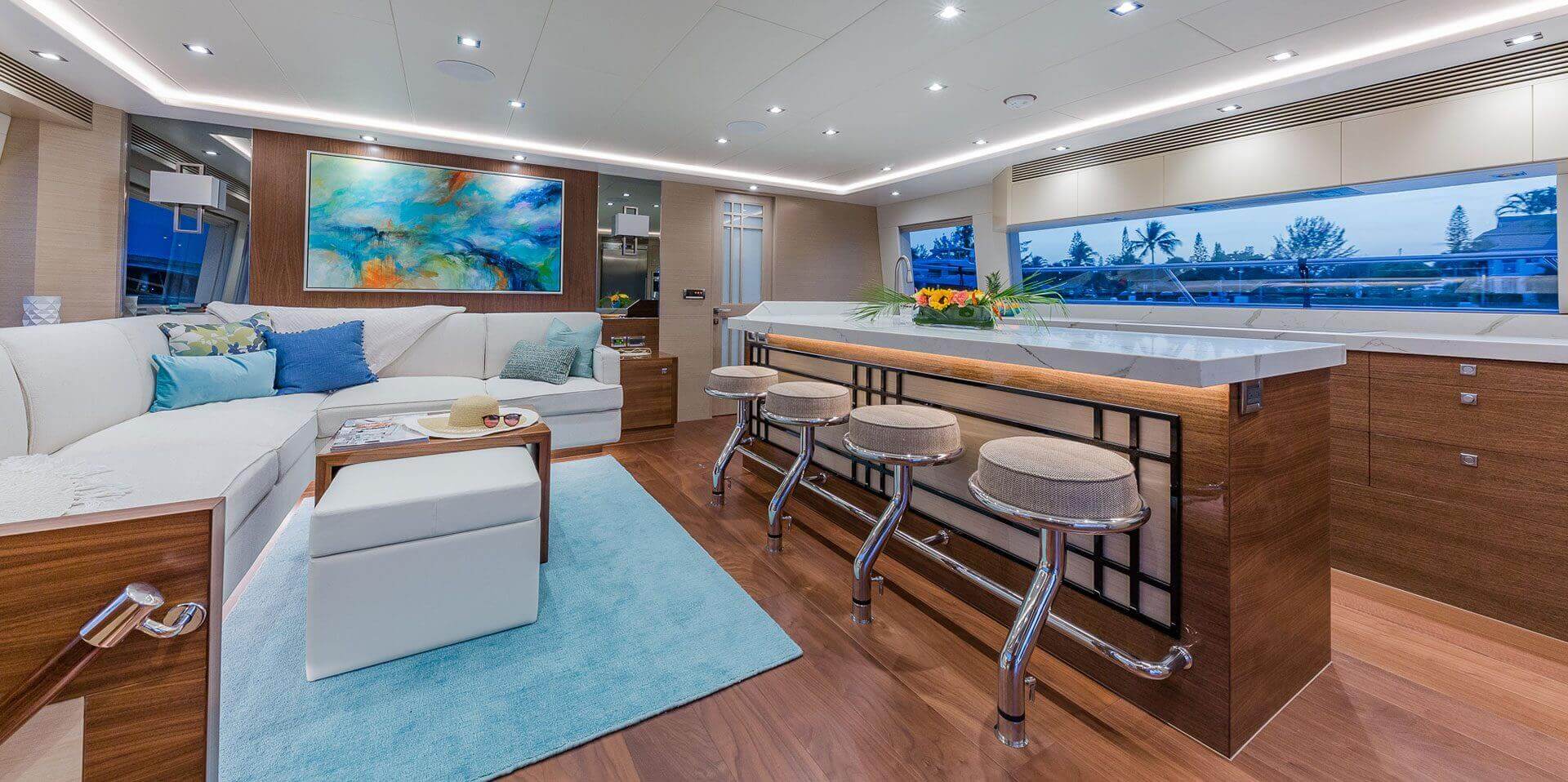The interior of an advanced luxury boat with a bar and couches.
