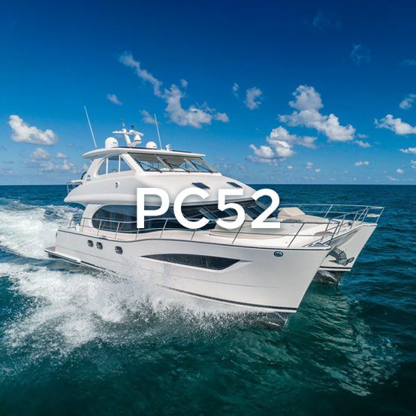 A pre-owned white boat with the words pc52 on it.