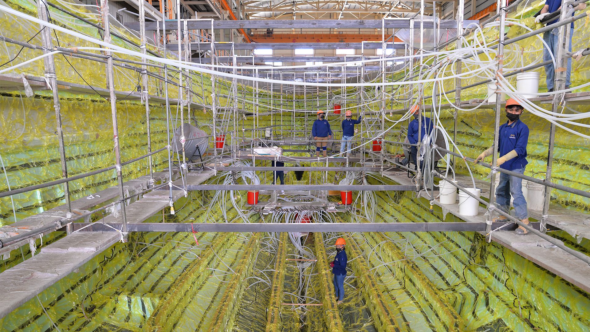 vacuum infusion process with workers