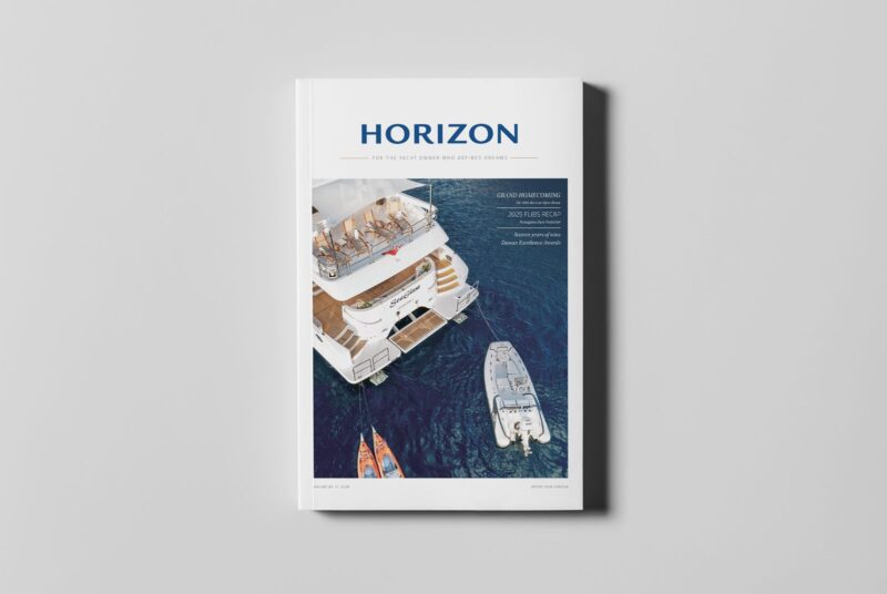 Magazine cover featuring yachts on the water.